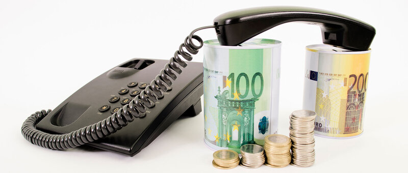 Telefon und Spardosen